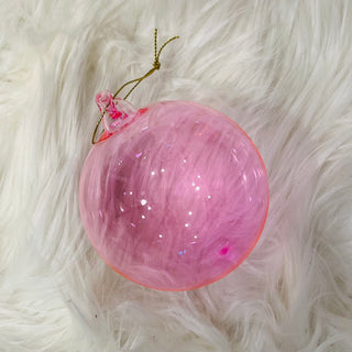 Blush Pink 4" Blown Glass Ornament on rug