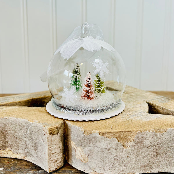 pastel bottlebrush forest snow globe ornament