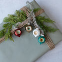Retro Tinsel & Indent Ornament Cluster On Gift